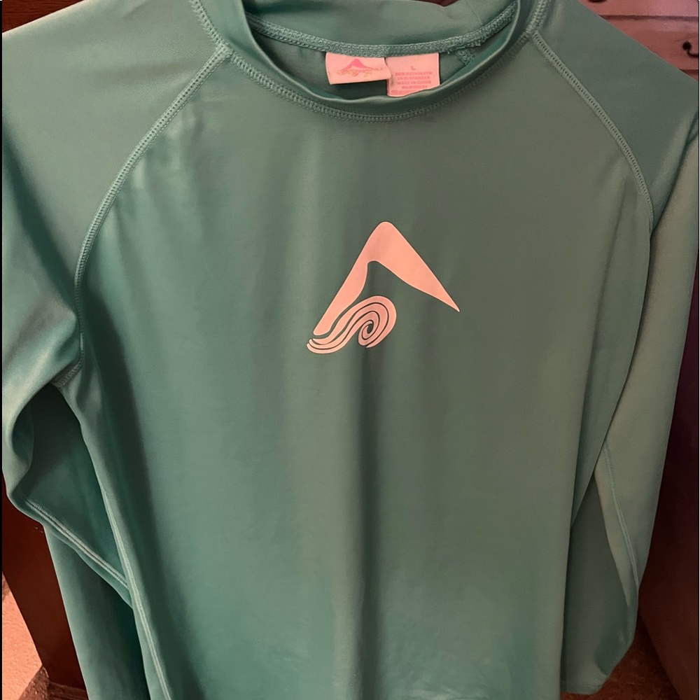 Kanu surf, dri-fit ladies shirt.